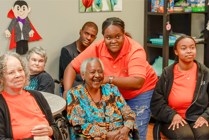Living a Dream staff and participants seated together